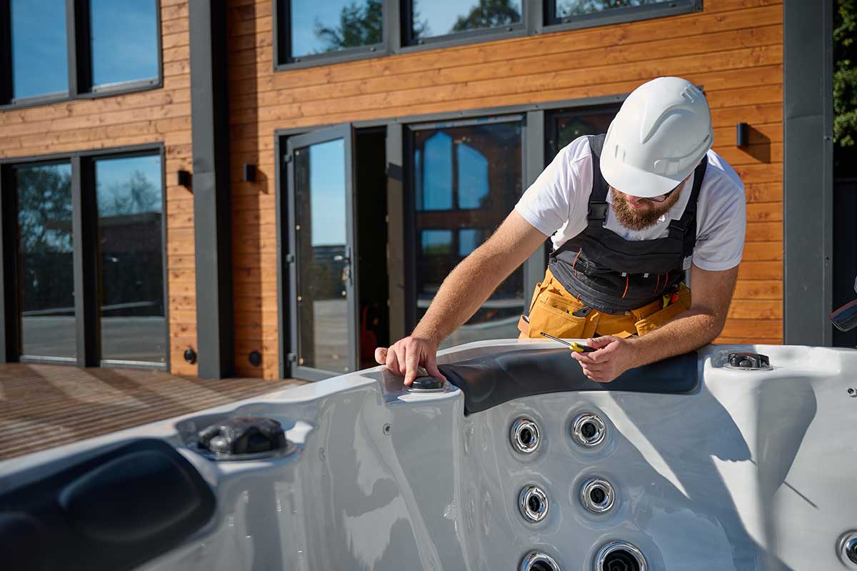 Hot Tub technician inspecting settings - empire pool and patio